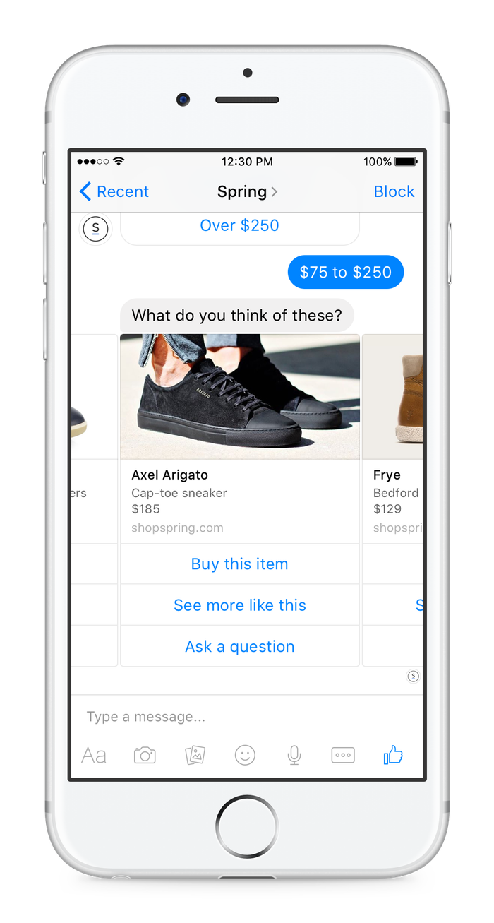 A phone displaying a message from Axel Arigato.