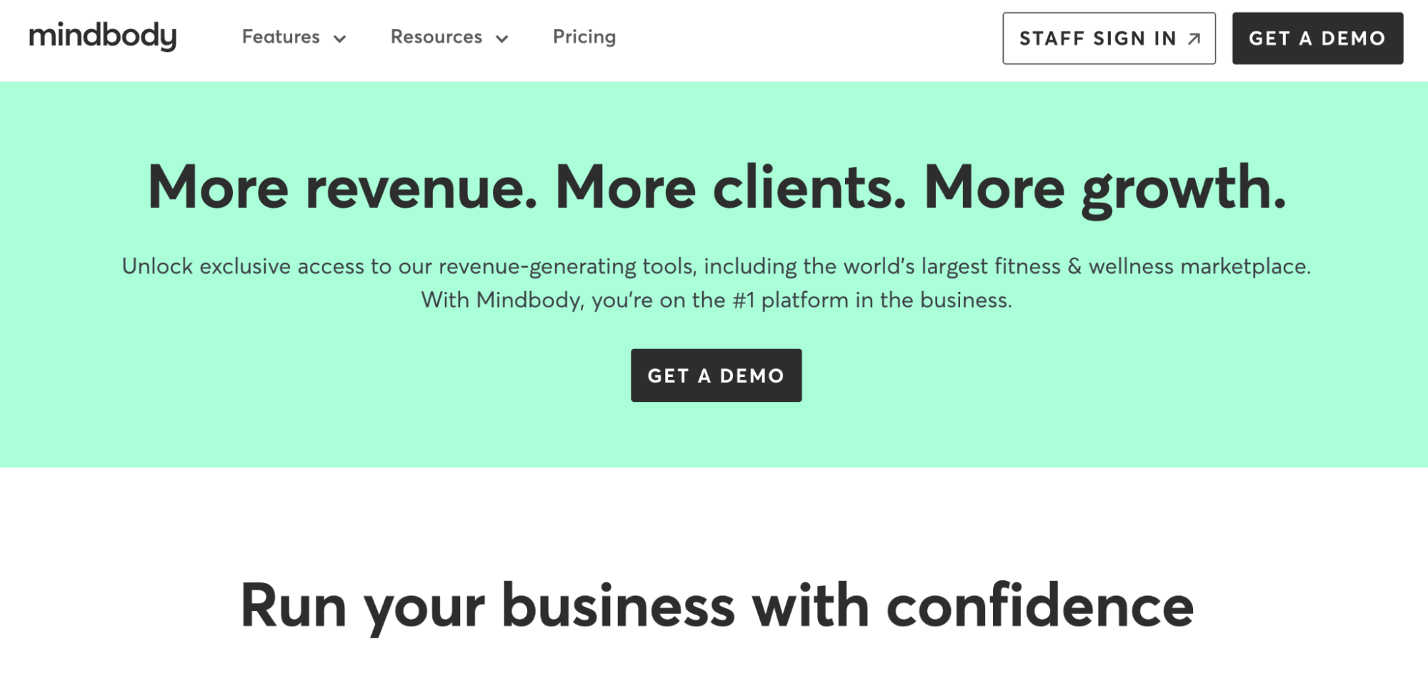 Mindbody website banner promoting "More revenue. More clients. More growth" for fitness and wellness businesses, with a "Get A Demo" button.