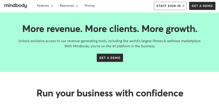 Mindbody website banner promoting "More revenue. More clients. More growth" for fitness and wellness businesses, with a "Get A Demo" button.