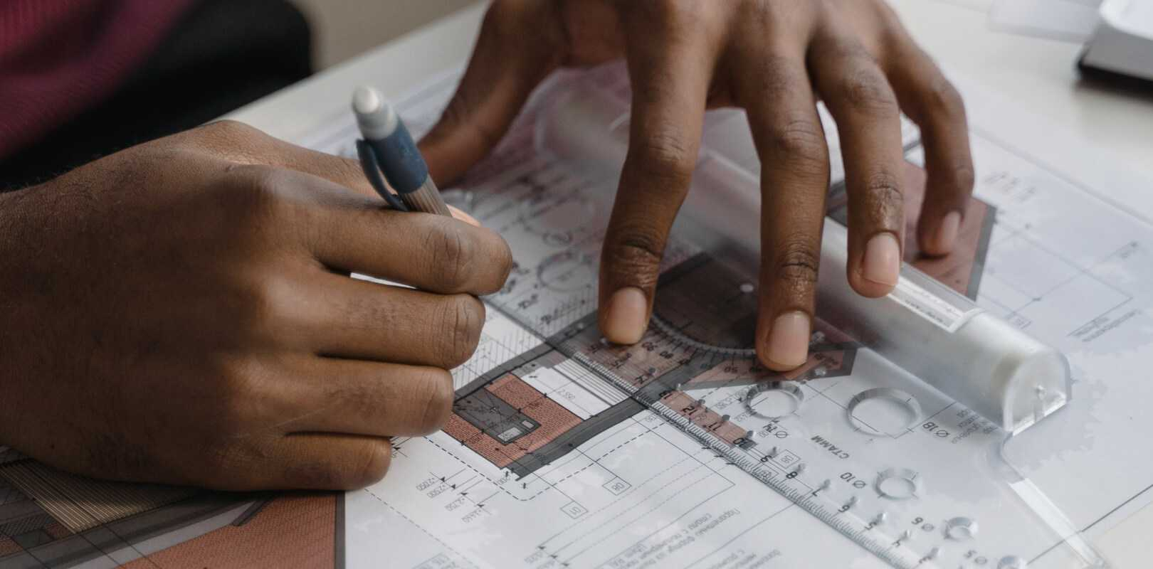 An architect working on blueprints