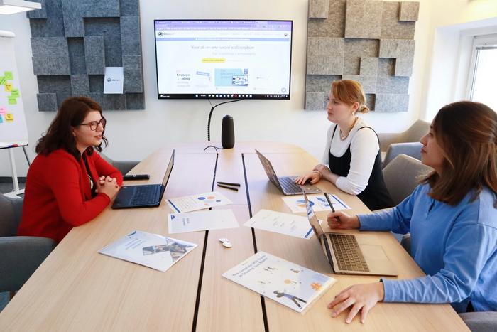 Three people having a meeting