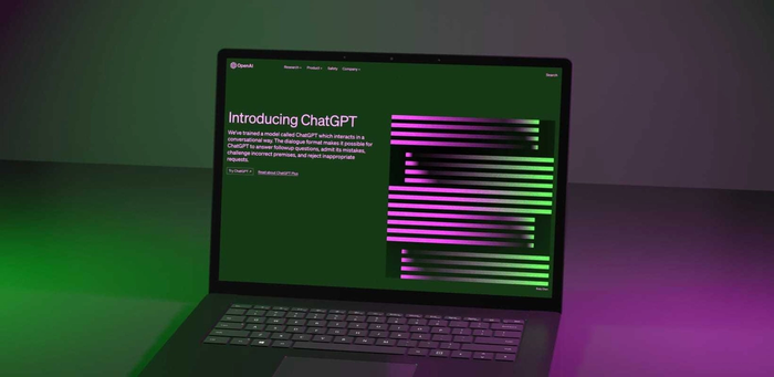 A laptop displaying the ChatGPT landing page