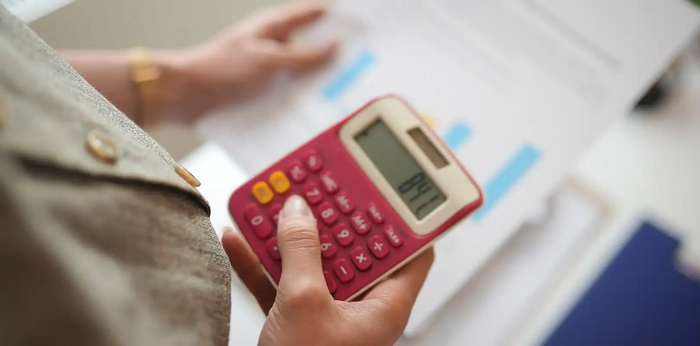 Someone using a calculator