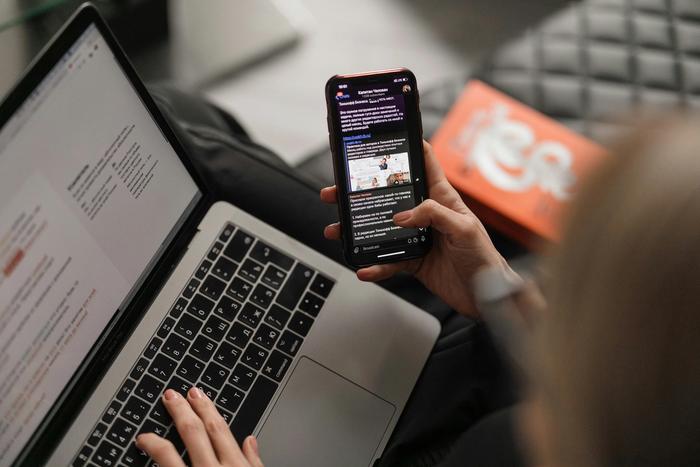 using a phone and laptop