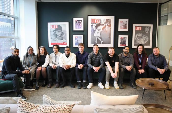 A group of NVOY technologies employees posing for a photo