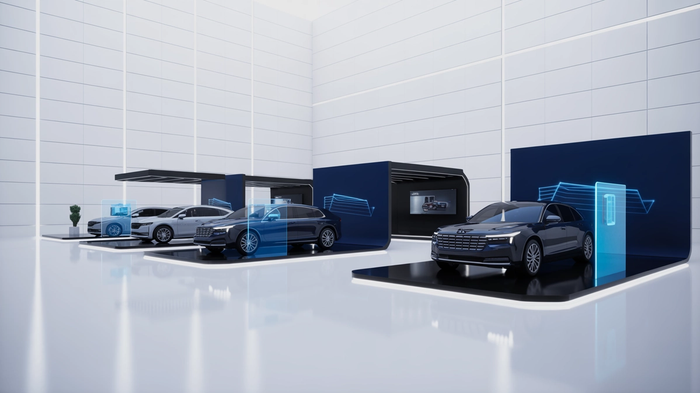 Several electric cars displayed in a futuristic showroom with blue digital interfaces around them.