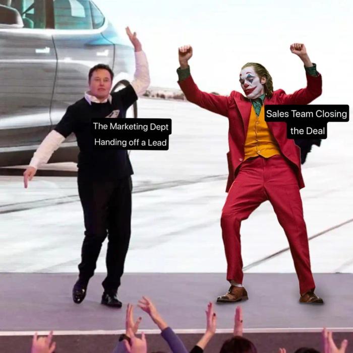 Elon Musk and the joker are dancing in front of a crowd - closing deal meme.