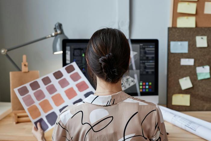 an interior designer looking at swatches