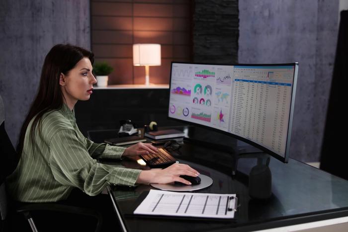 Woman looking at charts on a computer