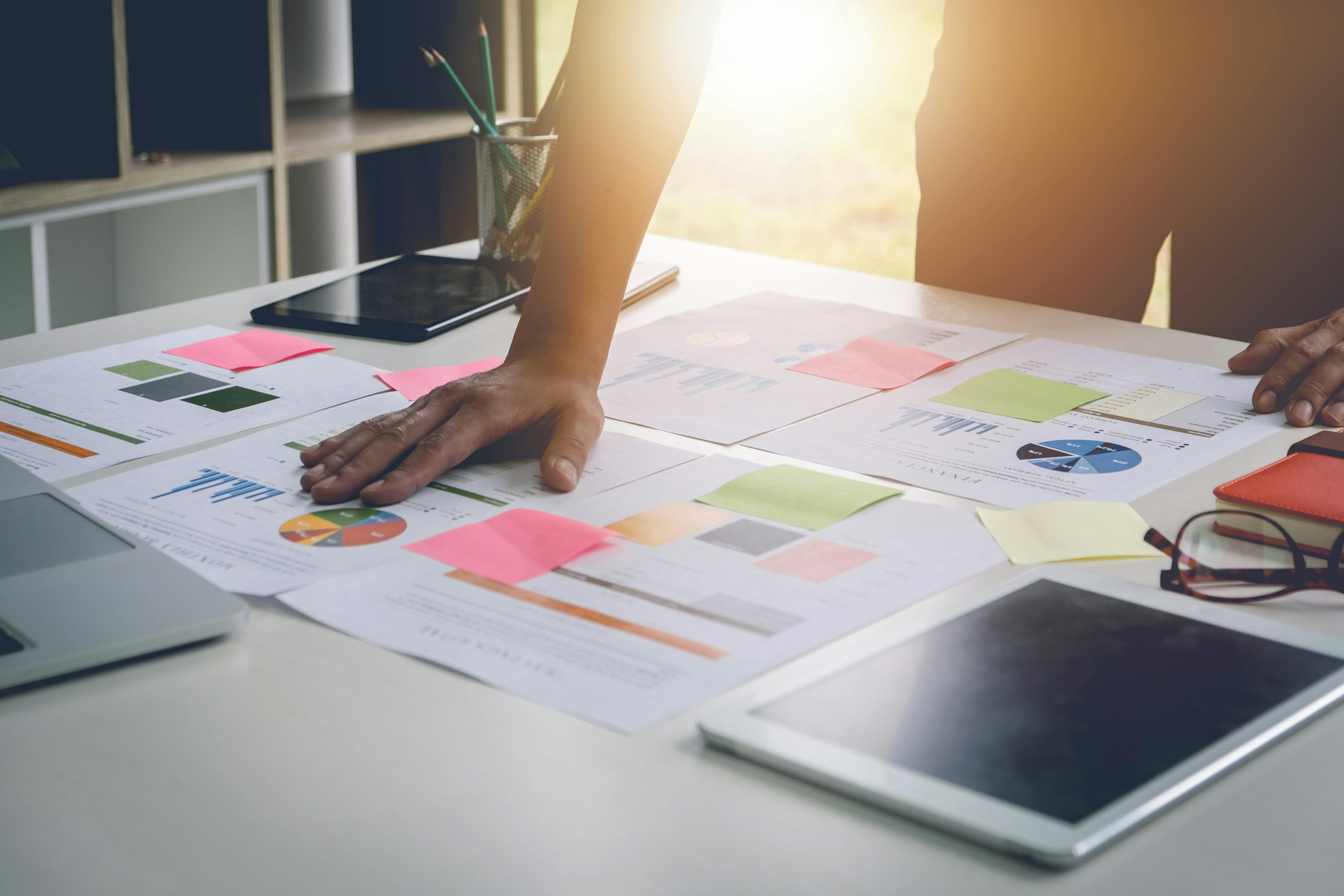 a desk filled with graphs and charts