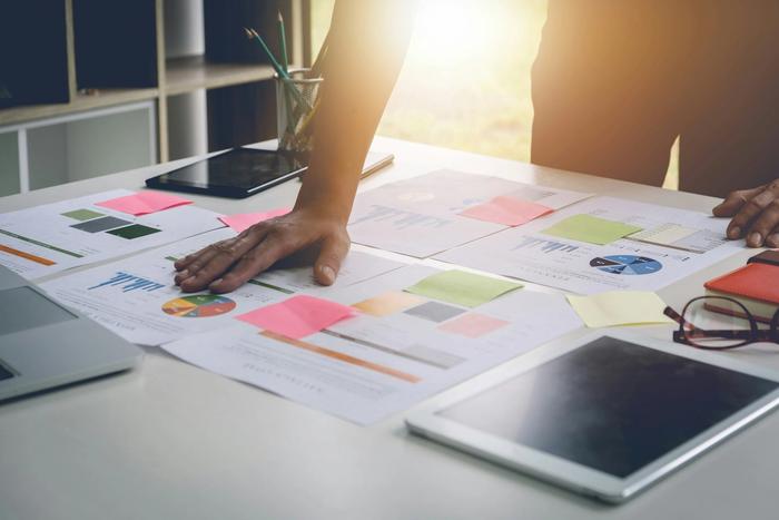 a desk filled with graphs and charts