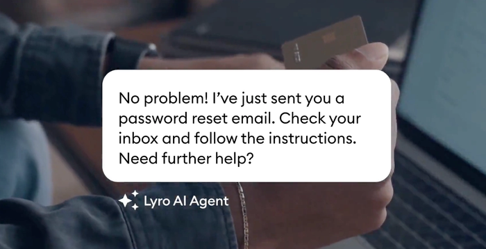 a person holding a credit card next to a lyro al agent logo
