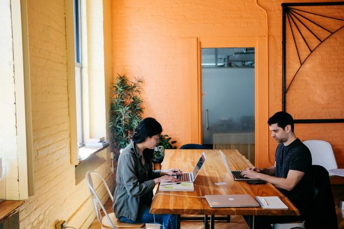 two people working at the same table