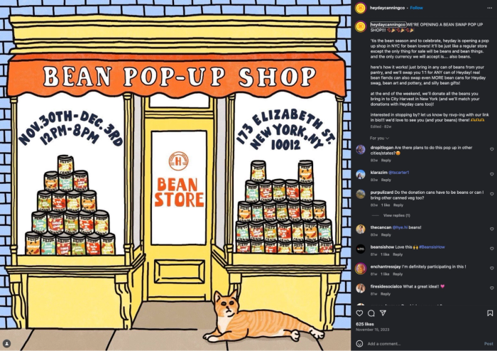 Cartoon-style promo for the "Bean Pop-Up Shop" by Heyday Canning Co. with event dates, address in NYC, and stacked cans of beans next to a lounging orange cat.