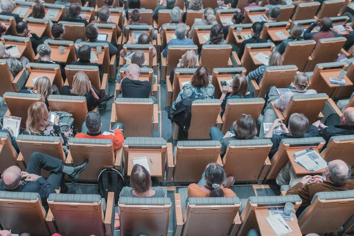 a crowd sat in an auditorium