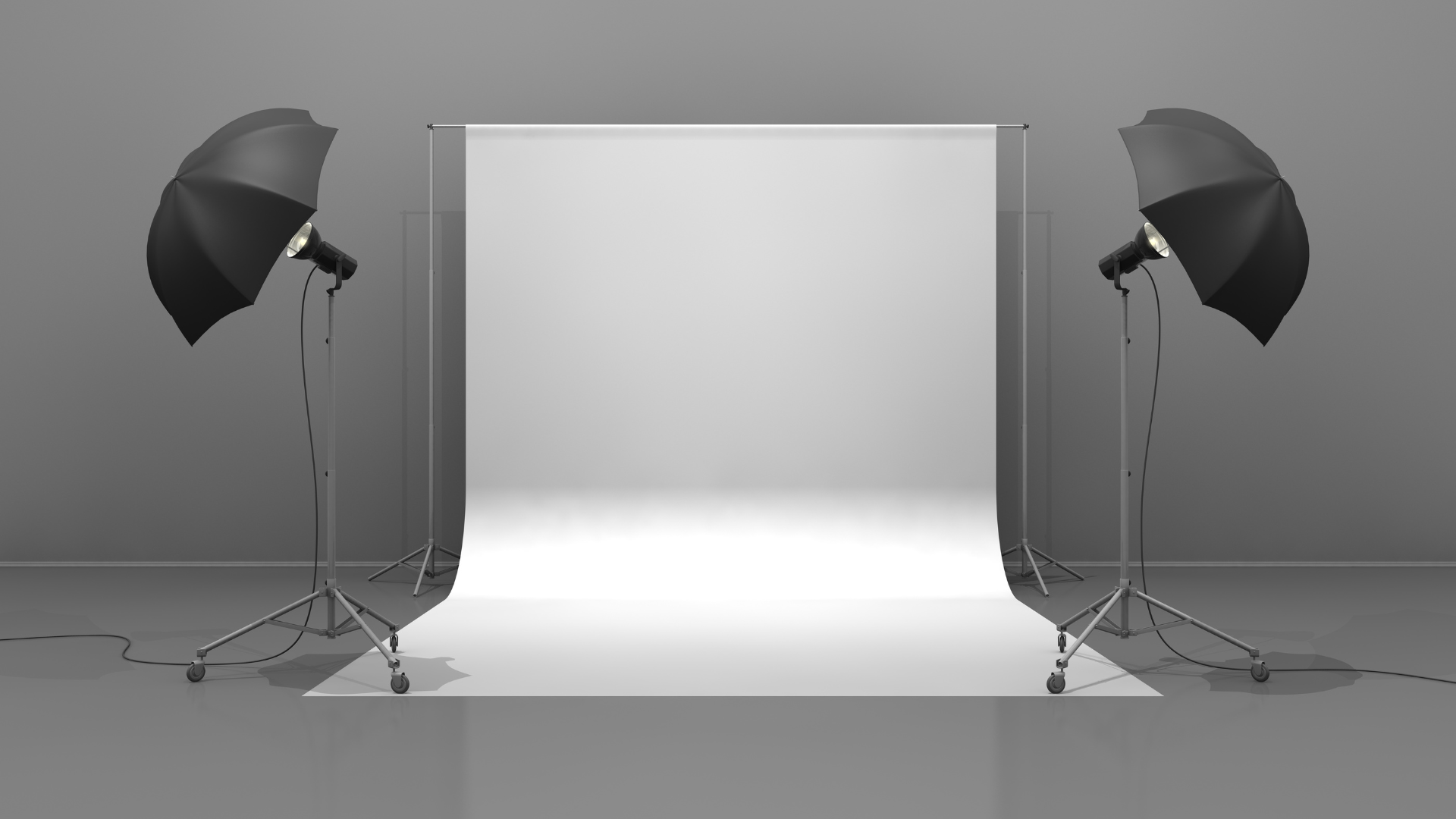 Photography studio with white backdrop and two umbrella lights