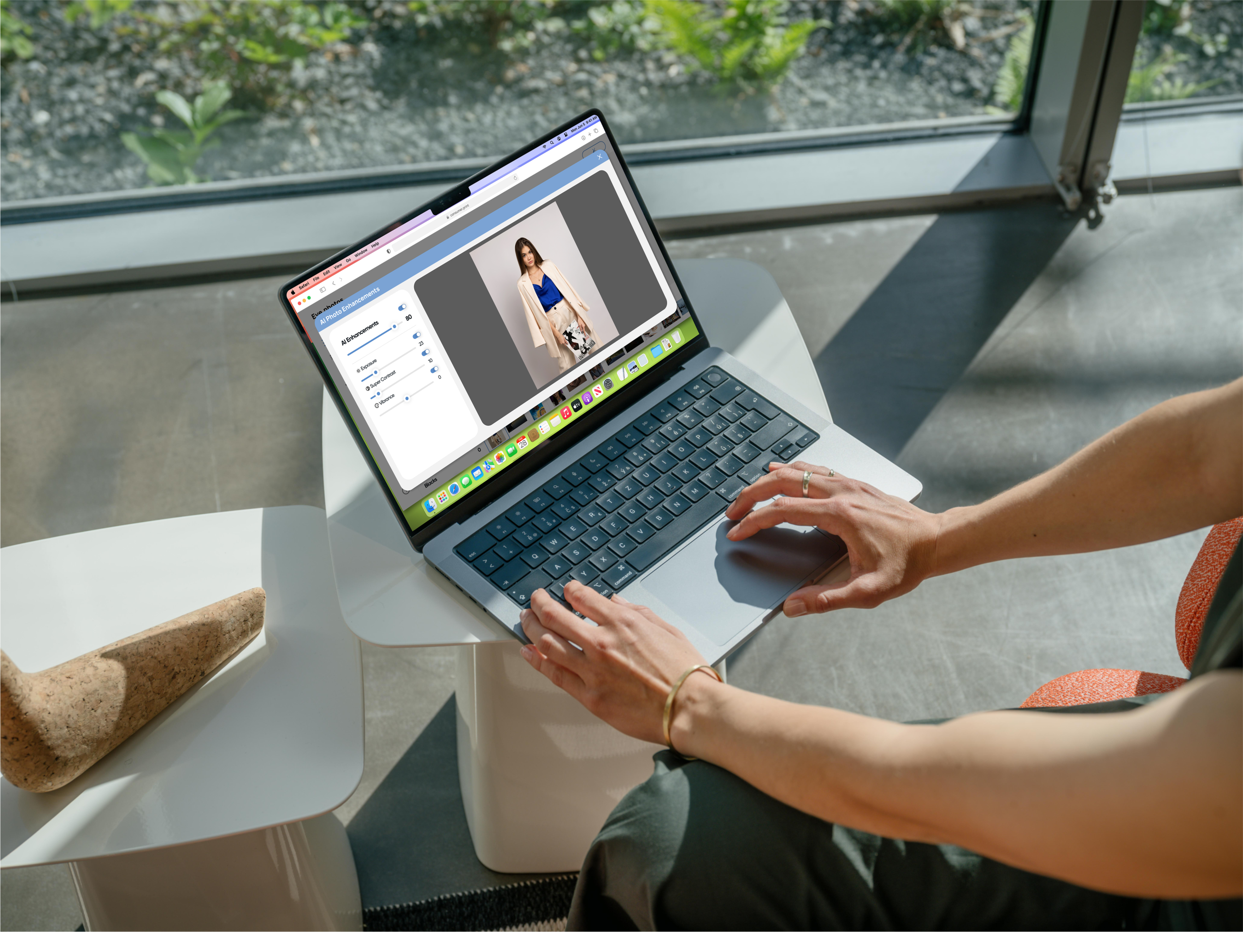 Woman edits a fashion photo on a laptop