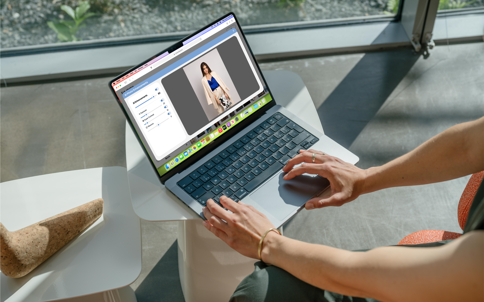 Woman edits a fashion photo on a laptop