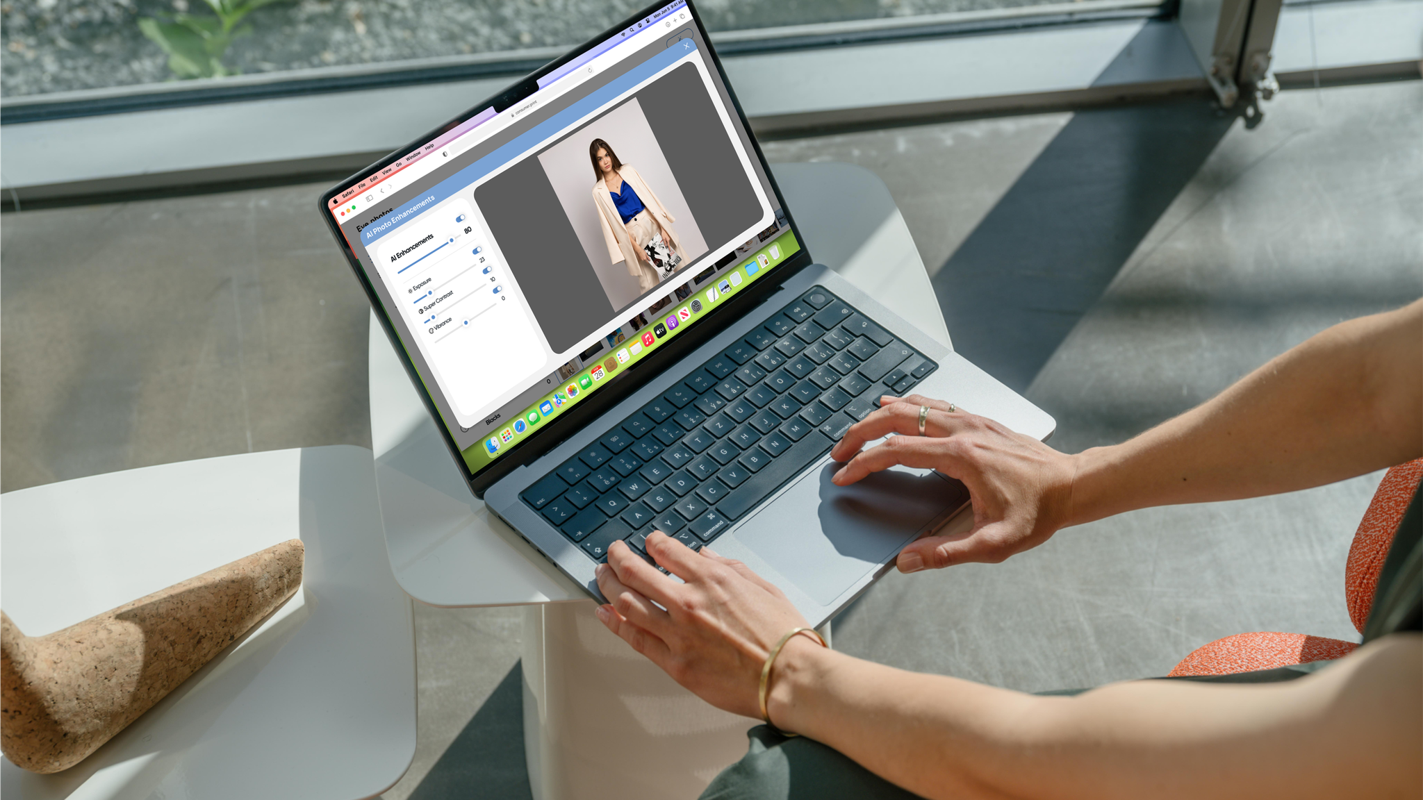 Woman edits a fashion photo on a laptop