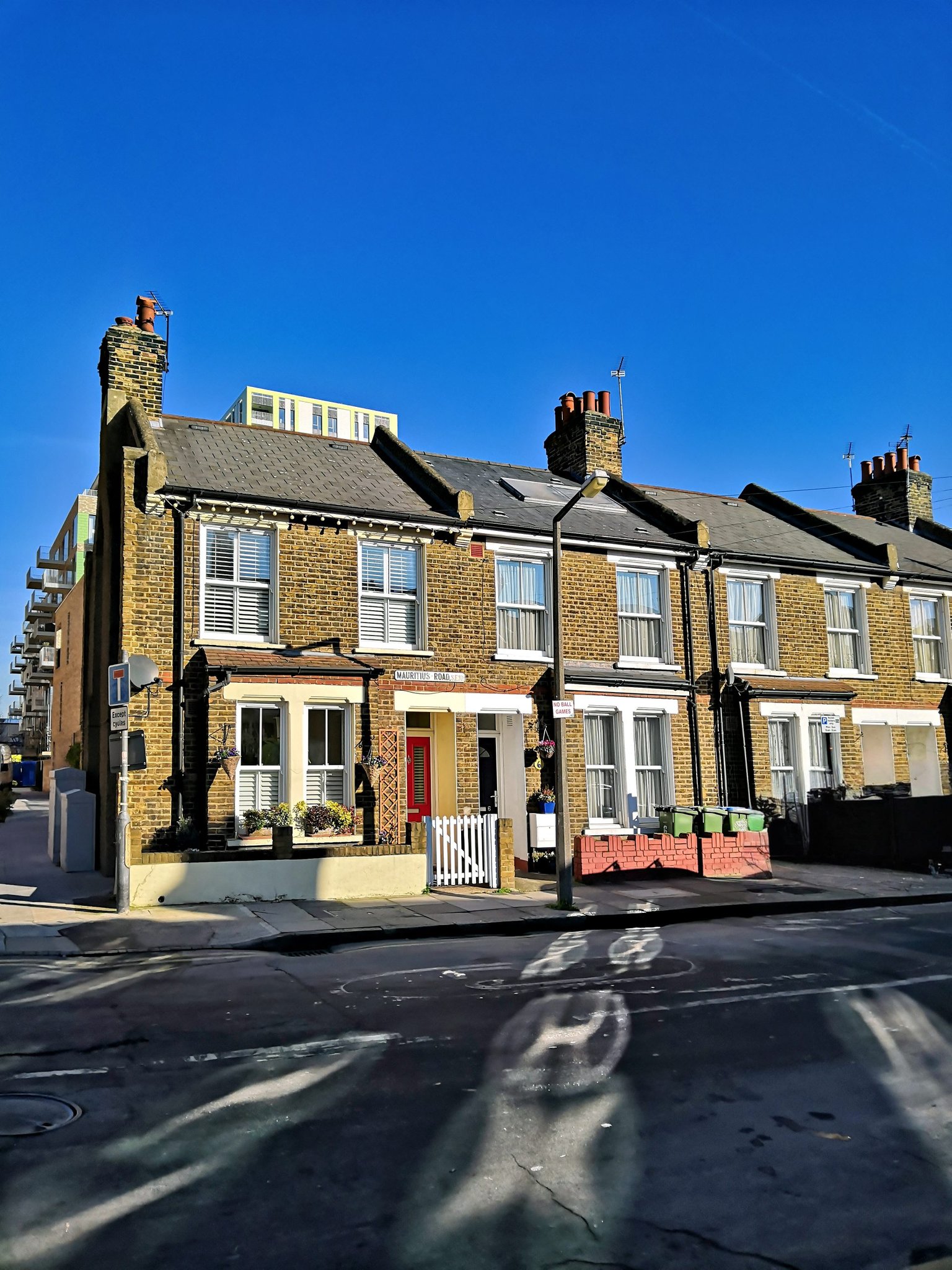 Brick terraced houses line Mauritius Road