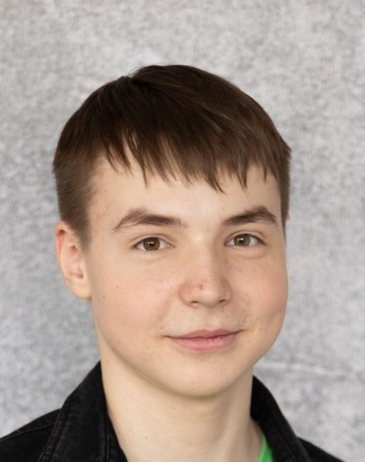 Young man with short brown hair facing the camera