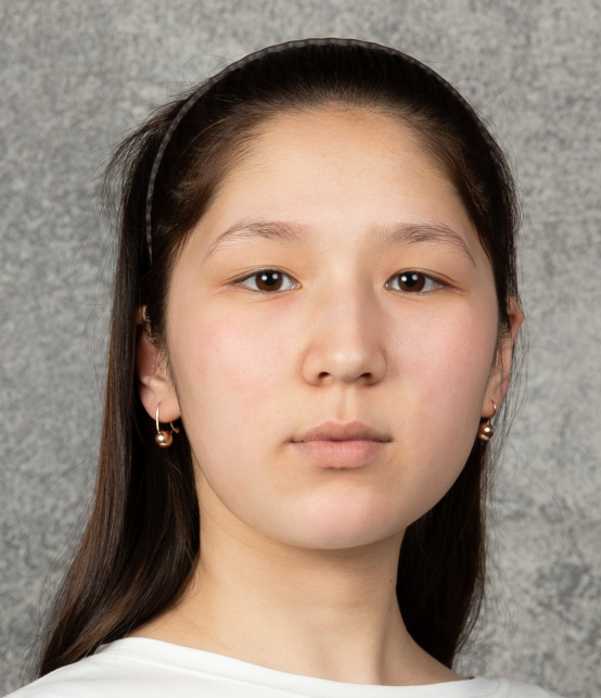 Young woman wearing a headband faces the camera