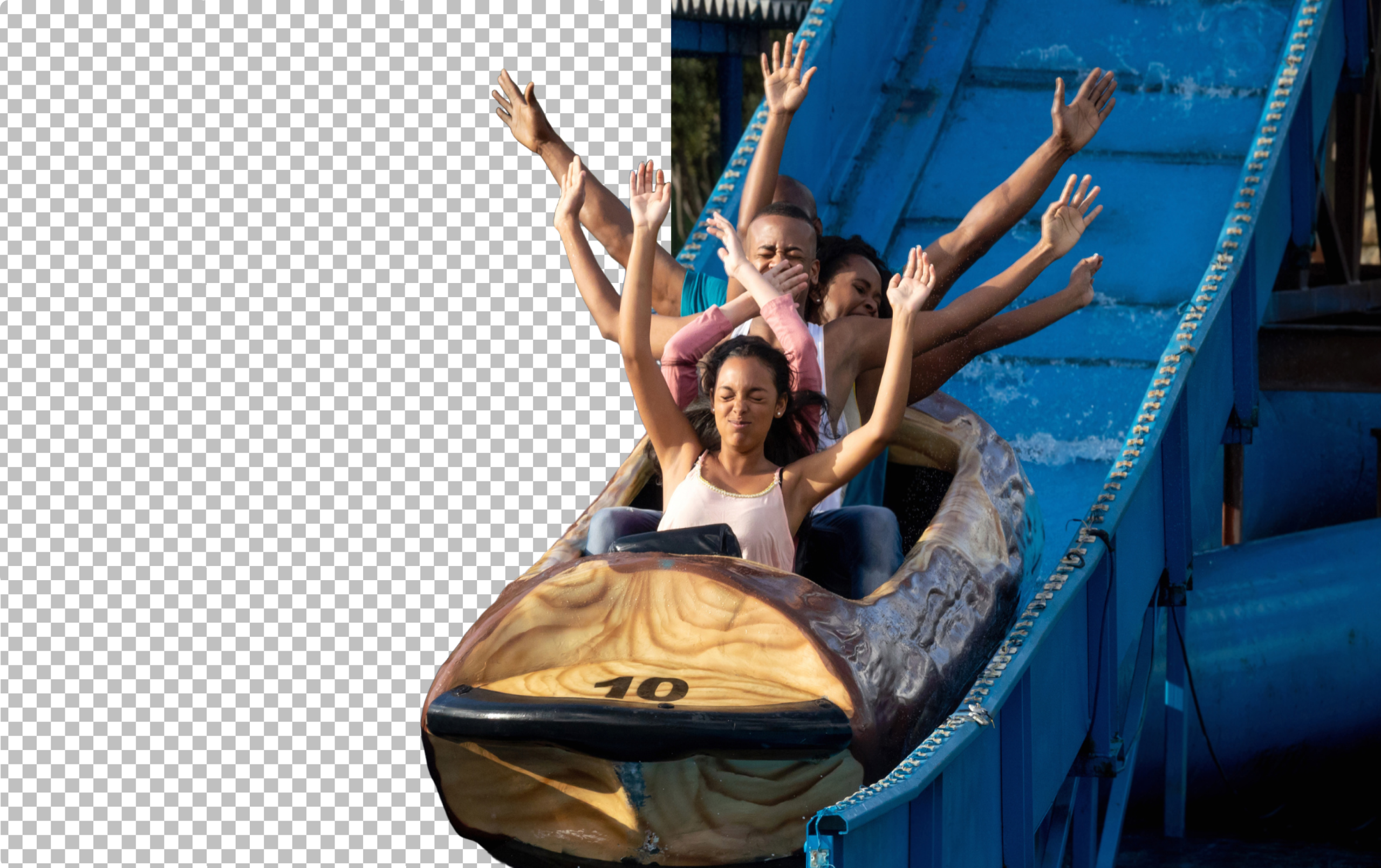 People raise their hands while descending a water ride