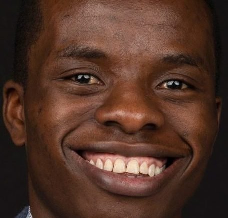 Close-up of a smiling young man's face