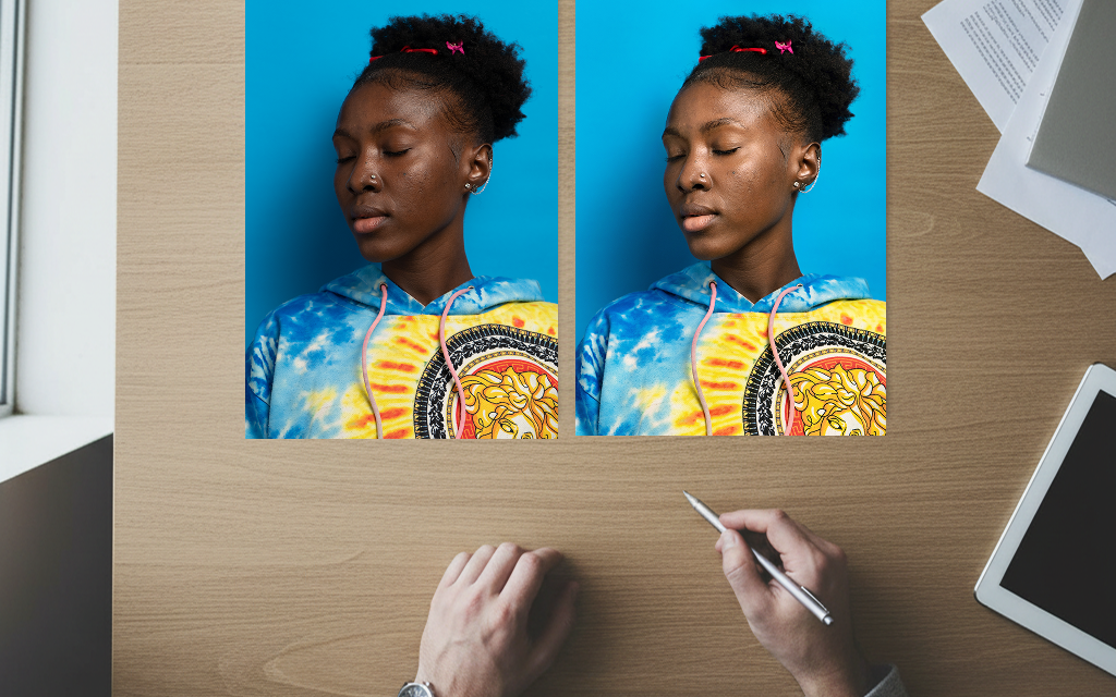 Two printed portraits of a young woman compared side by side on a desk