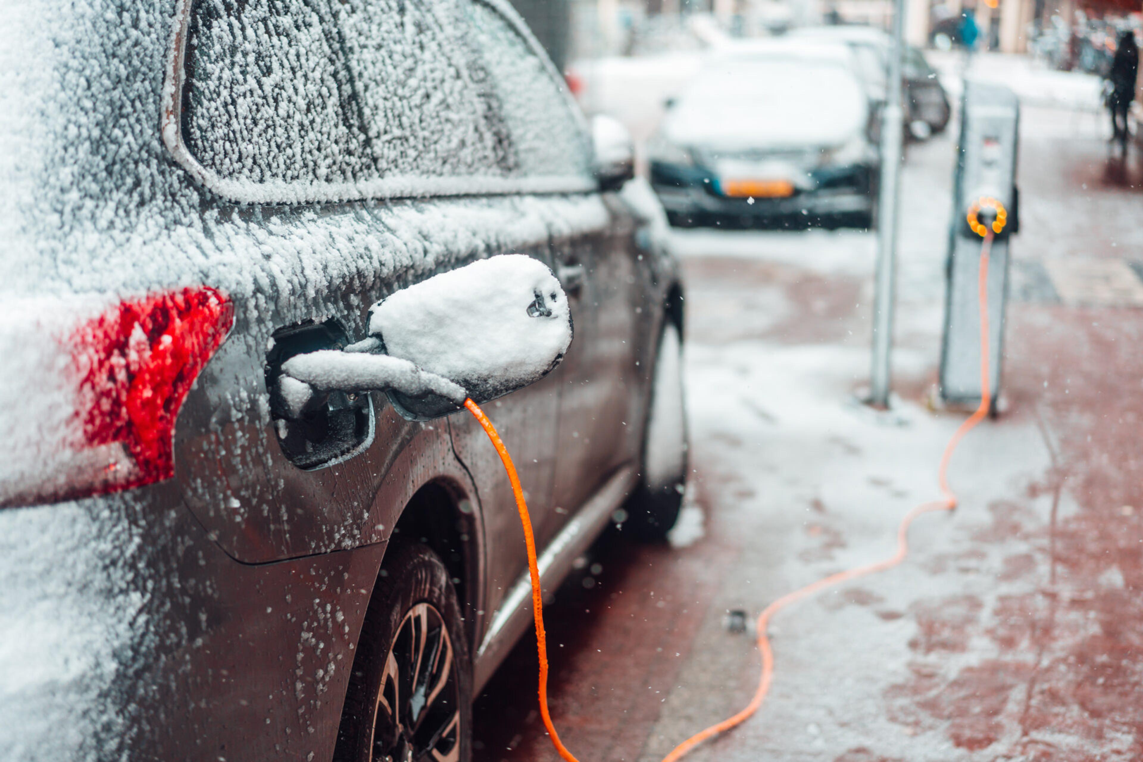 A picture of a snowy EV charging