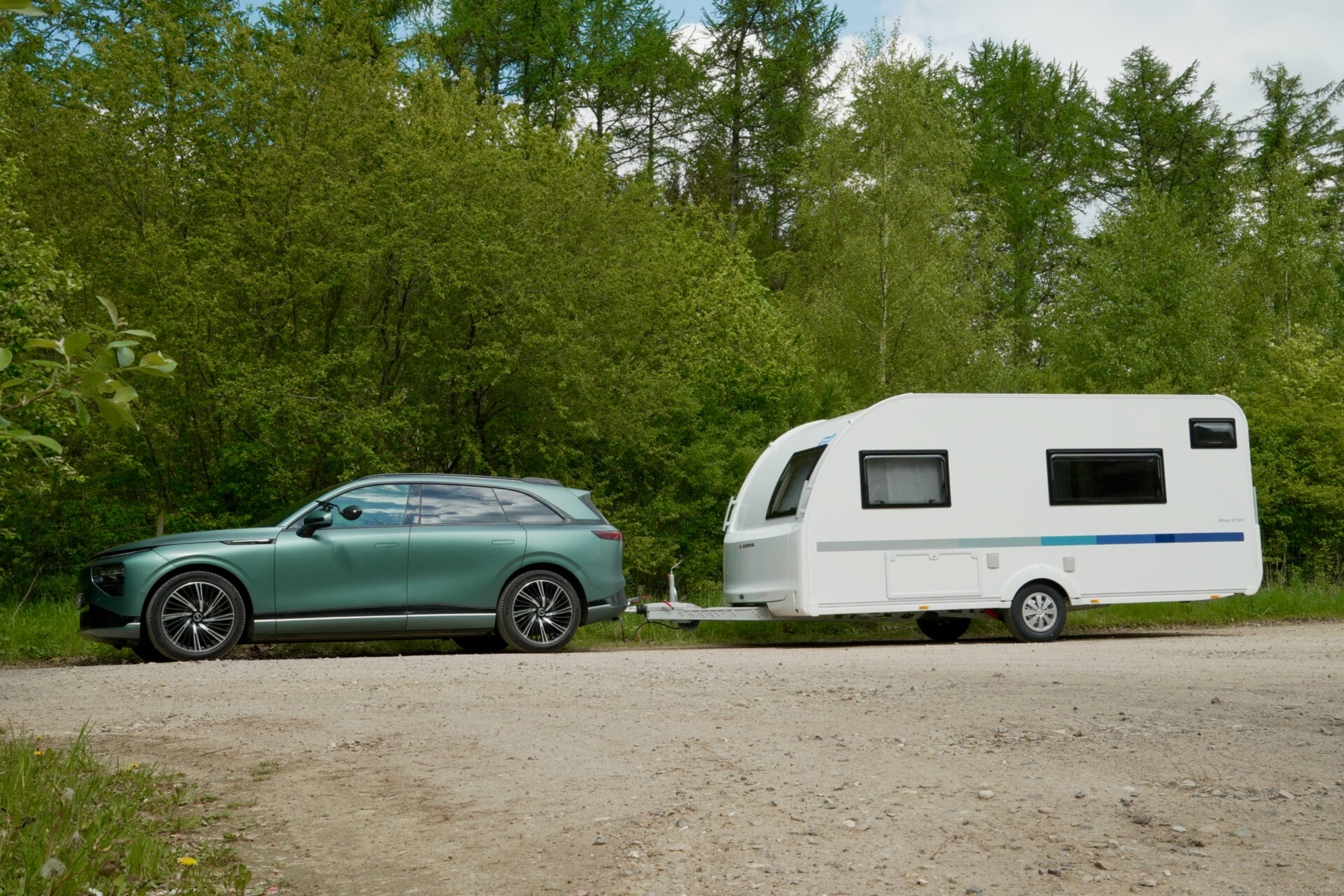 Xpeng G9 car with attached camping wagon