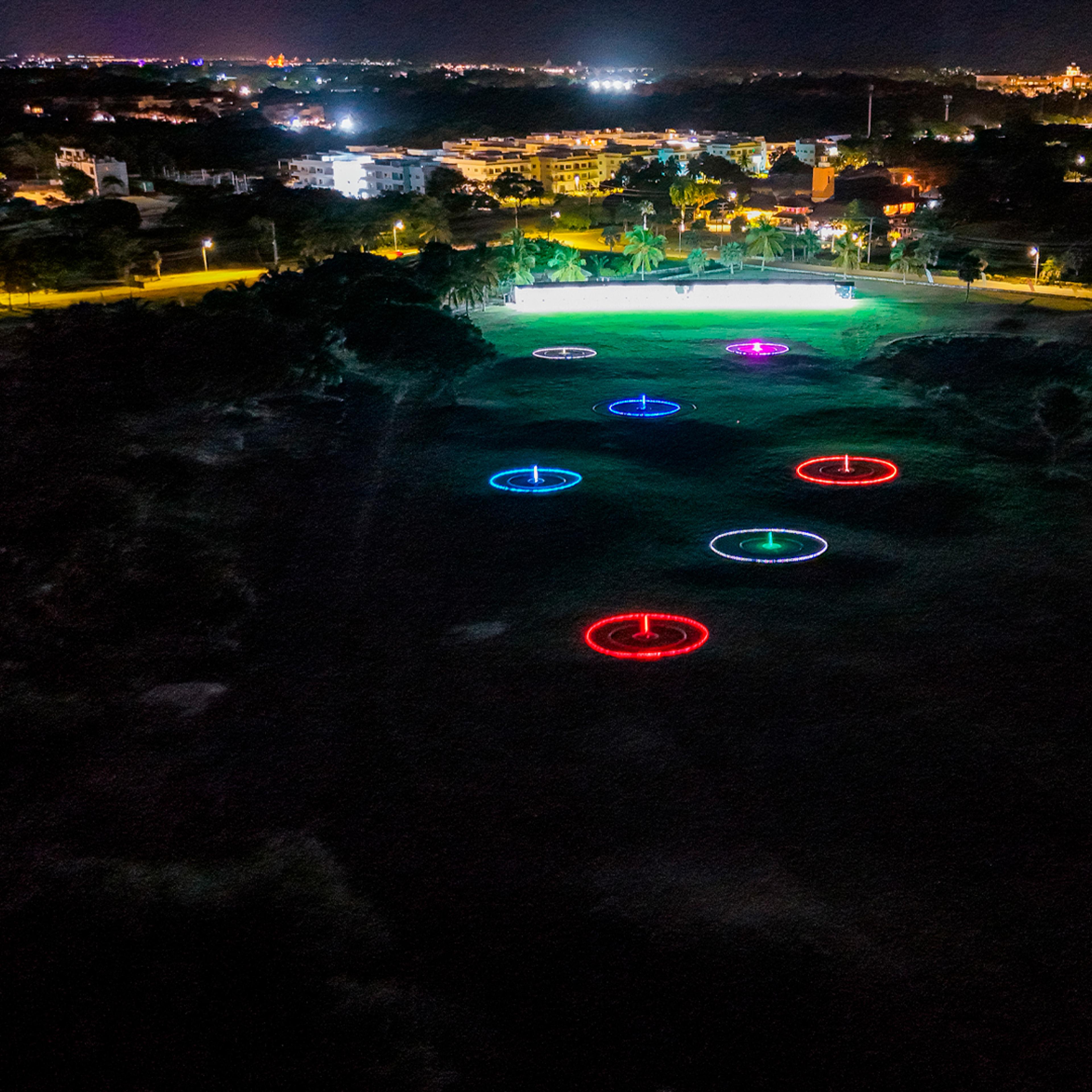 Glow-in-the-dark driving range targets at Golf N Shots Punta Cana at night