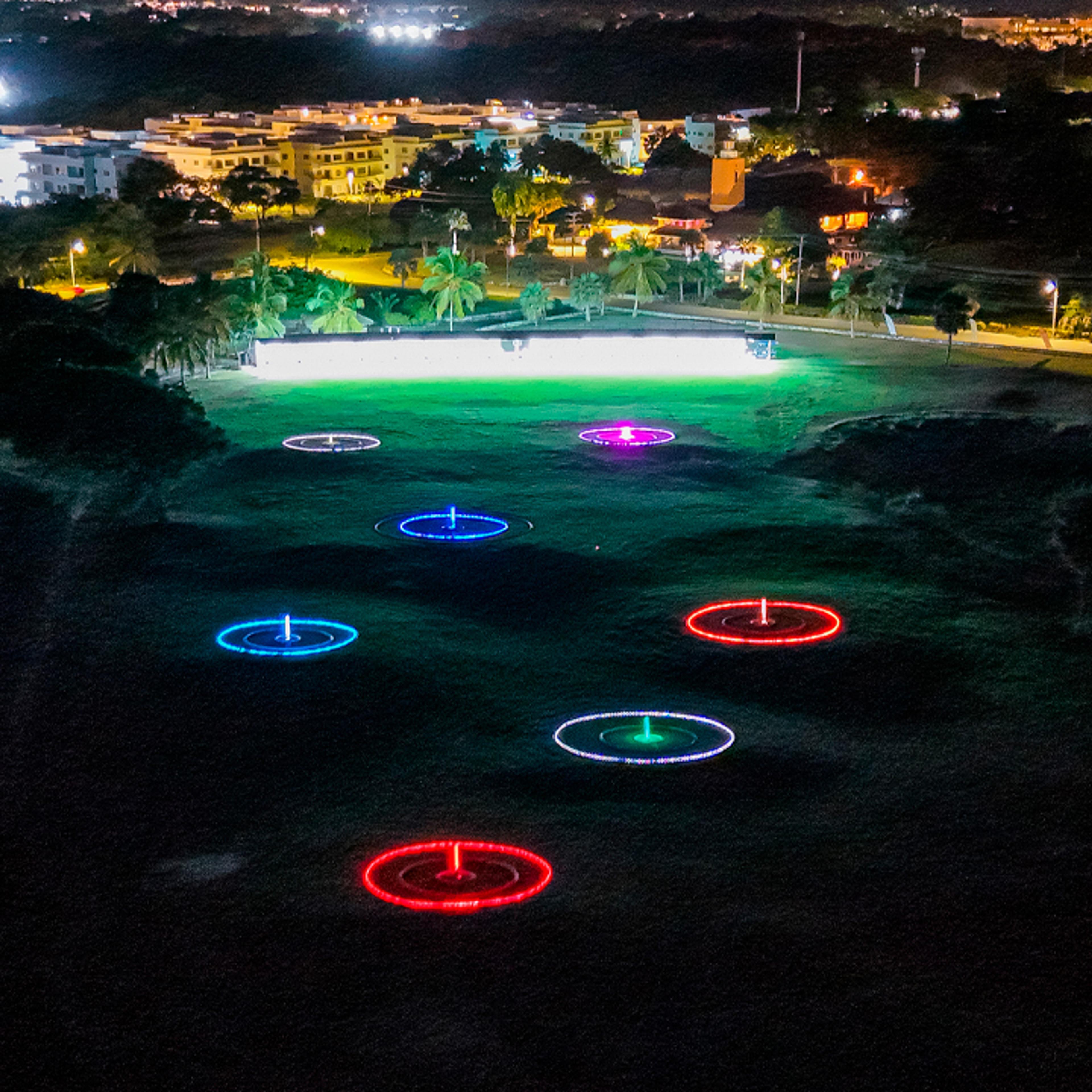 Glow-in-the-dark driving range targets at Golf N Shots Punta Cana at night