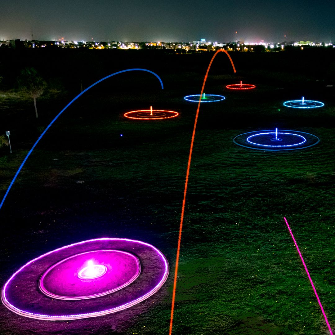 Glow-in-the-dark golf balls and bay at Golf N Shots Punta Cana at night
