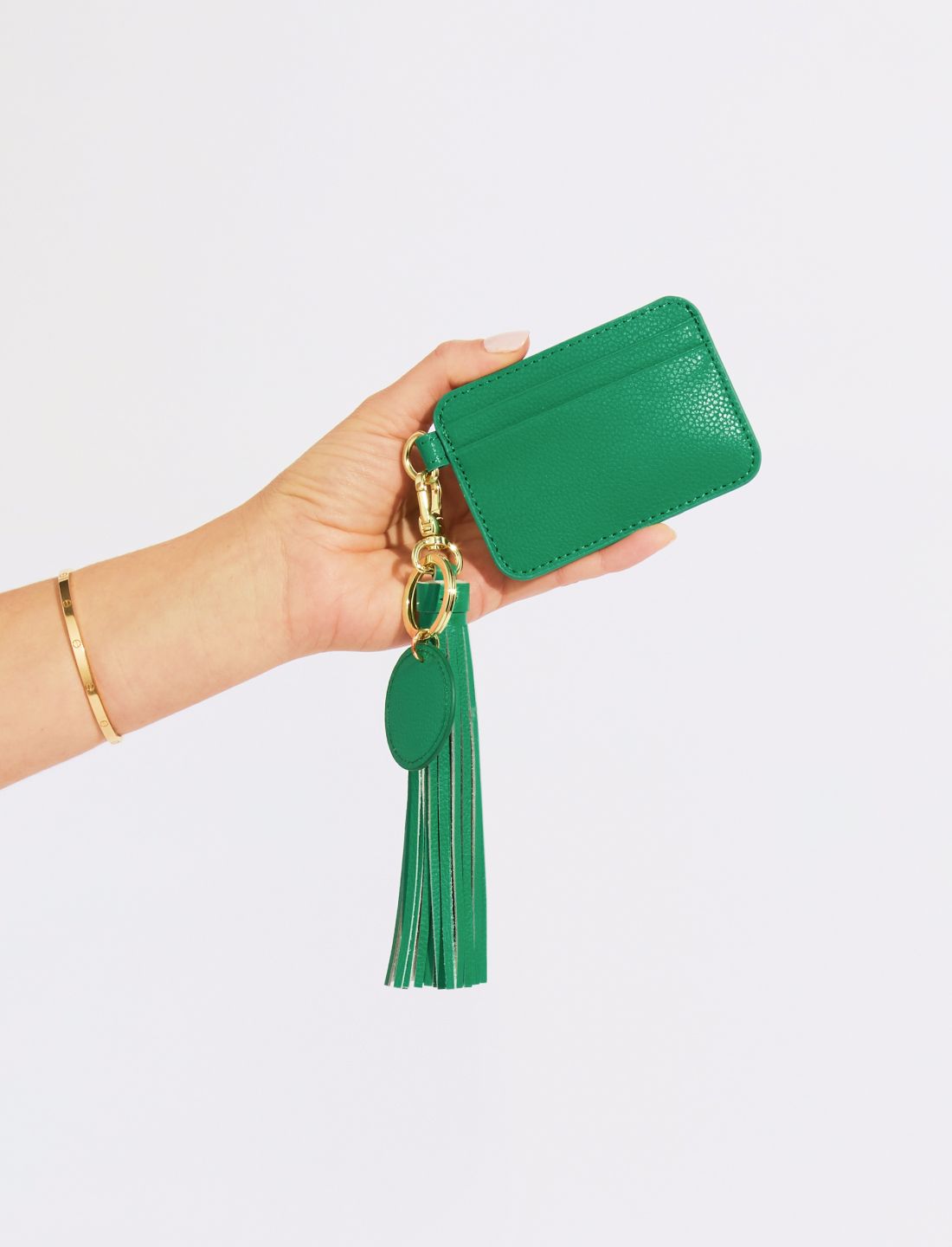 Hand holding an Emerald Green Leather Card Holder