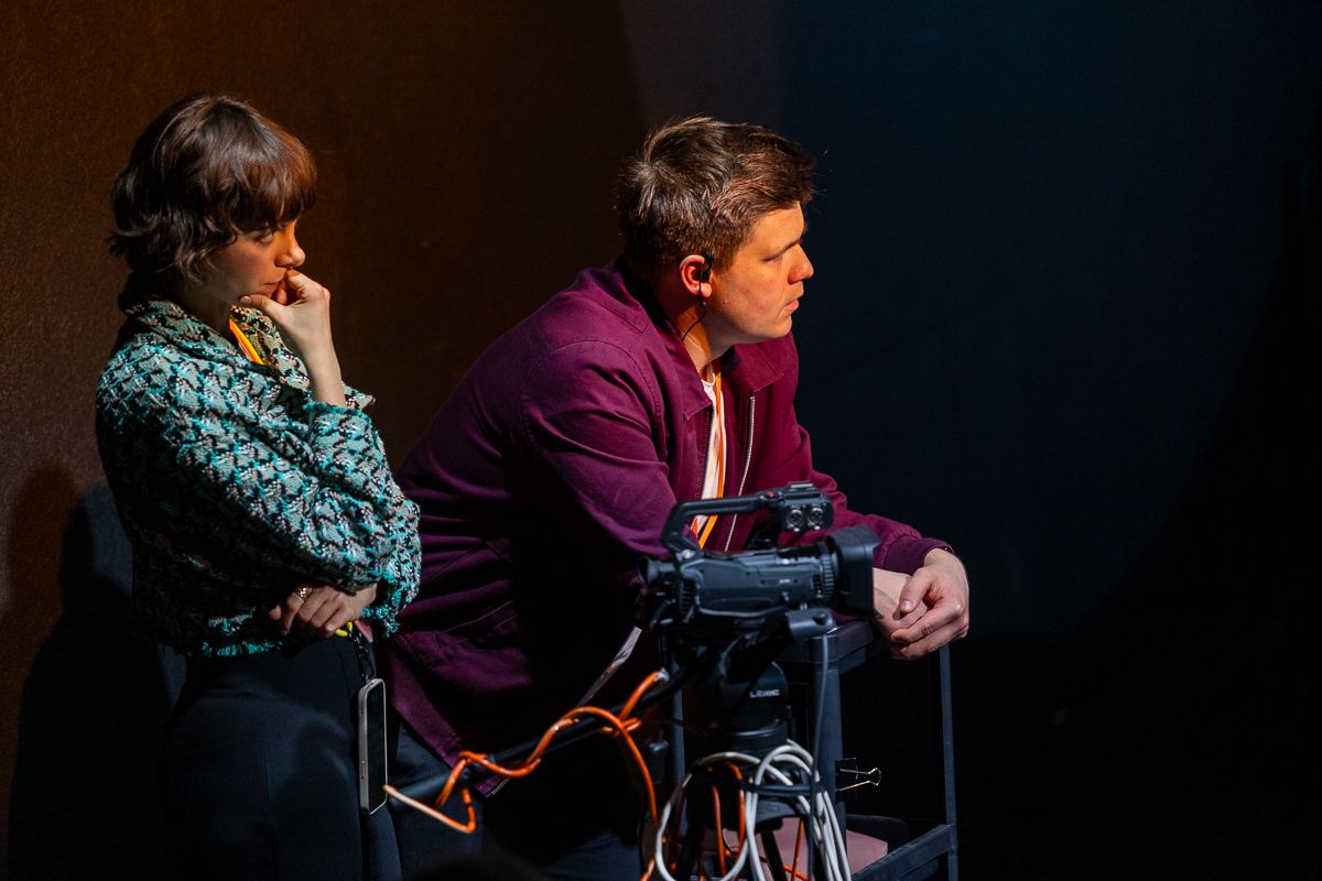 A man and a woman listening in concentration