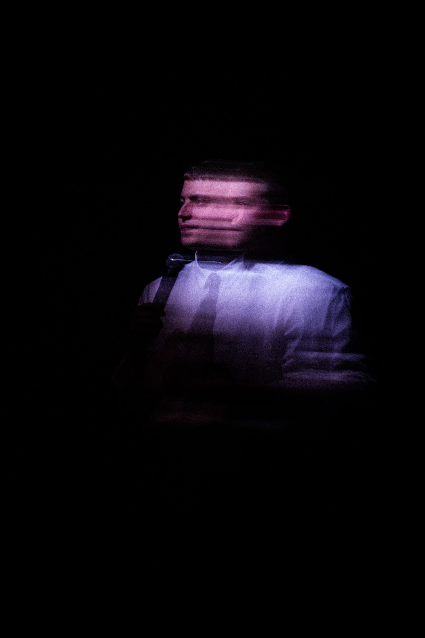 Blurred man with a microphone