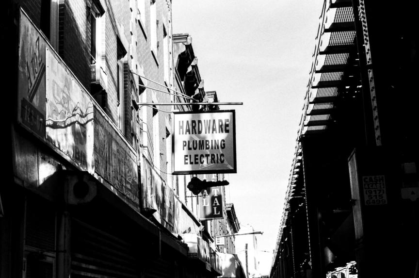 hardware store sign, black and white