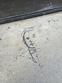 scribbled man on sidewalk
