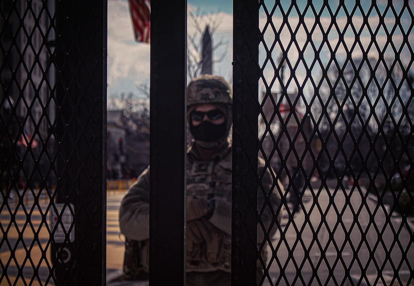 military police stan behind metal gates on inauguration day