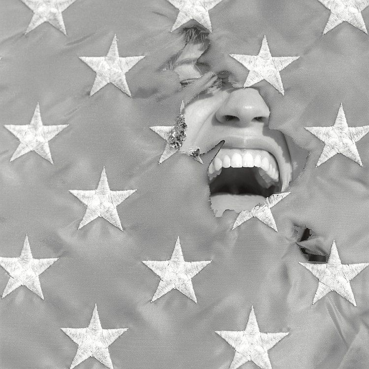 screaming through a torn flag