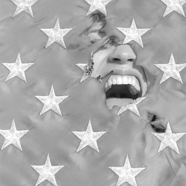 screaming through a torn flag