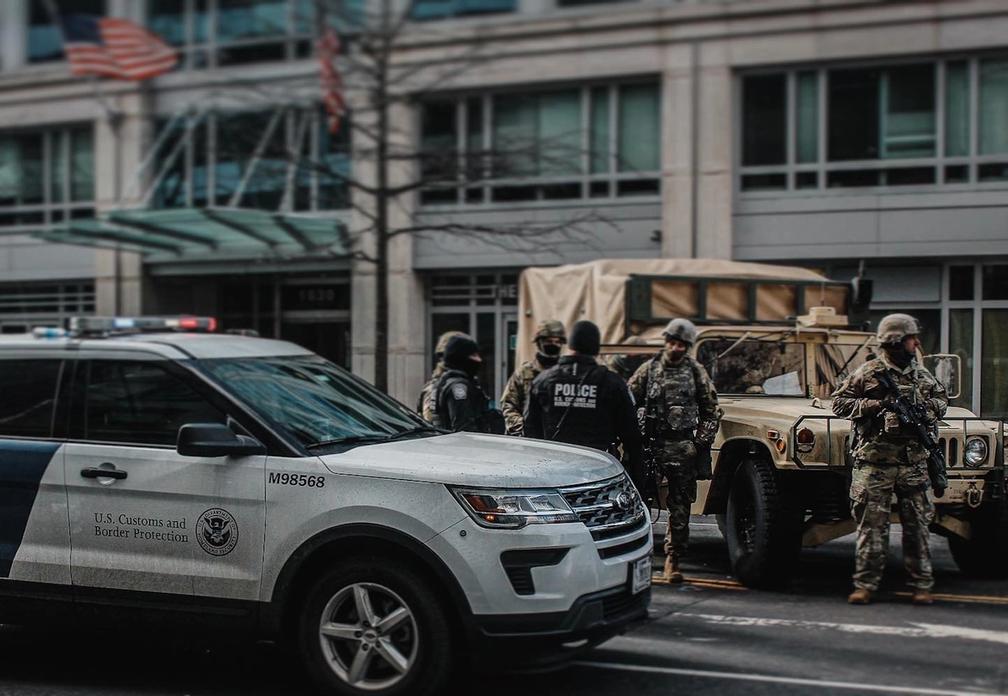 CBP and military police stand at an intersection close to inauguration green zone