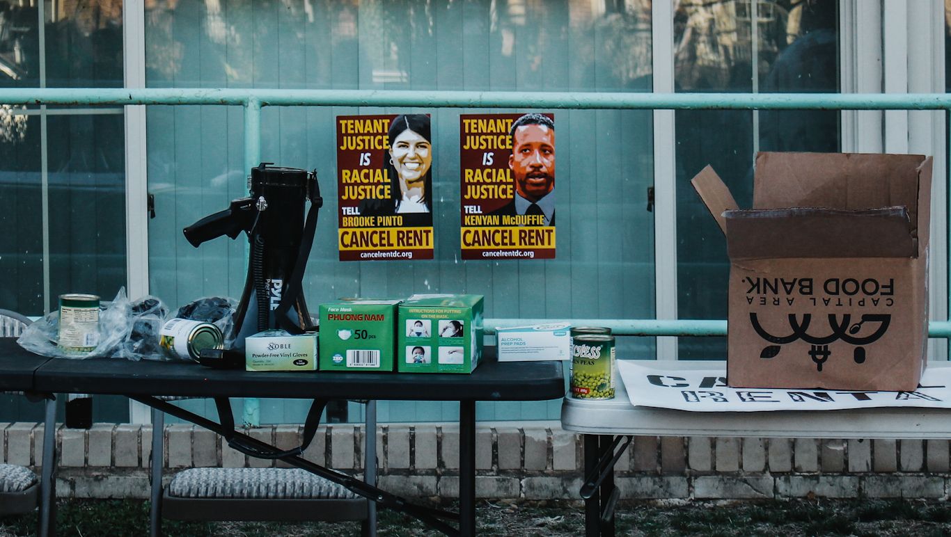 cancel rent signs at a rally