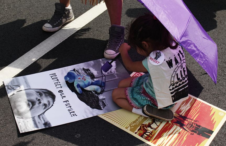 protect our future kid at climate parade