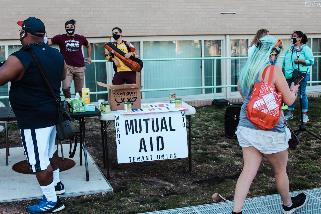 A DC Ward 1 Mutual Aid table set up at a Cancel Rent rally to support tenants. Eleanor Goldfield | ArtKillingApathy.com