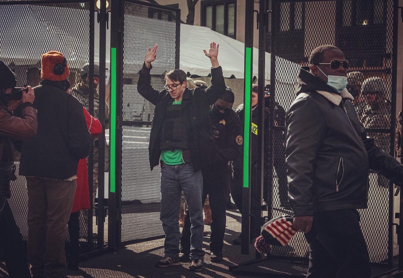 man with bullet proof vest on standing to be wanded at entrance to inauguration green zone