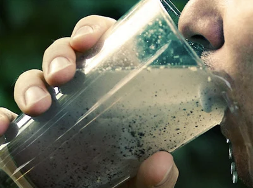 person drinking very dirty water