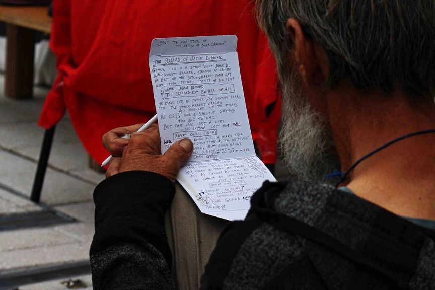 protest song notes outside FERC