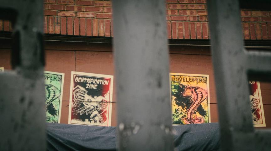 Graphics by DC artist Divorce Culture pasted around AdMo plaza: Developers Burn in Hell, Gentrification Zone. 